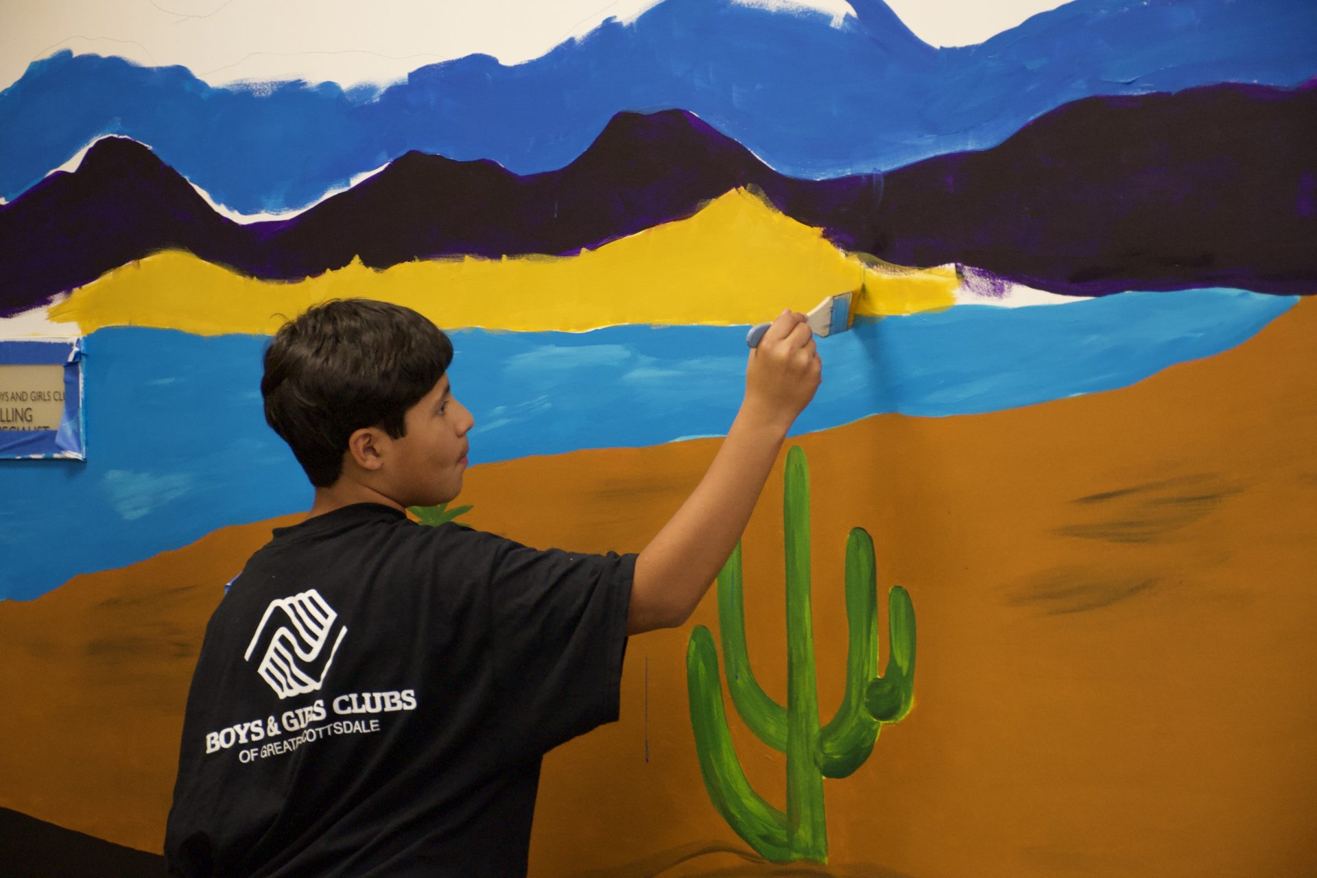 Boys & Girls Club Youth at WOLF Paint New Mural