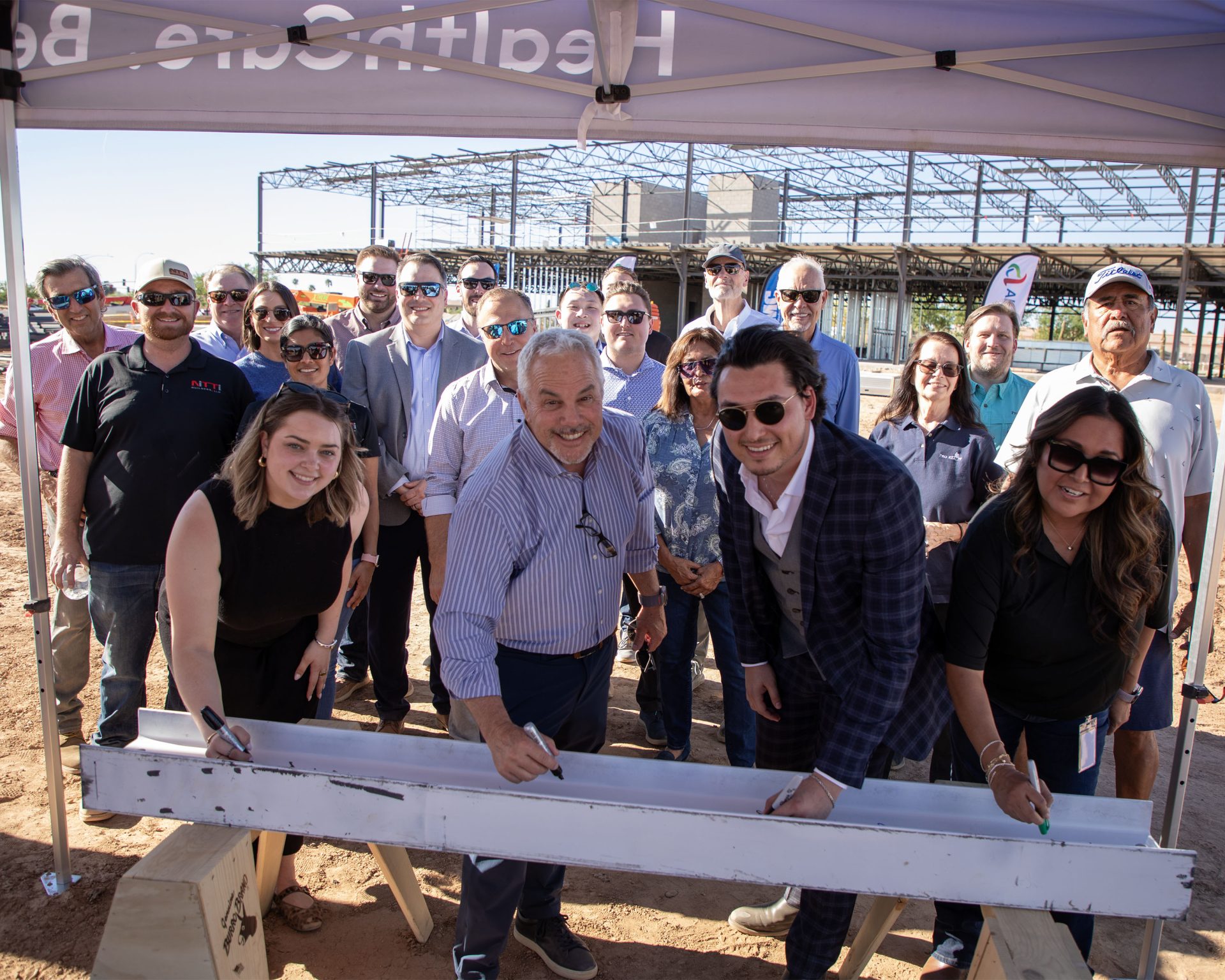 Arizona Sports Medicine Center Holds Beam-Signing on Tribal Land
