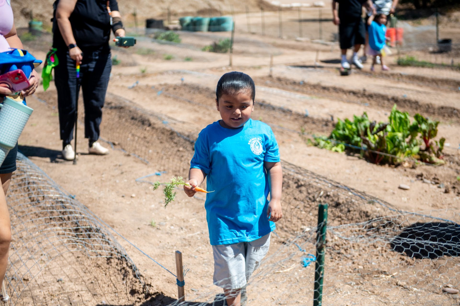 ECEC Students Learn Where Their Food Comes From at Community Garden
